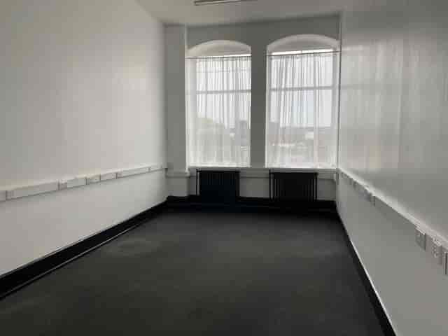 Minimalist meeting room in Crown House, ideal for workshops with natural light.
