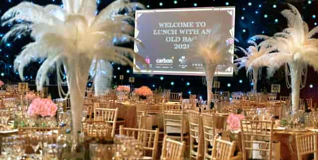 Prestonfield Stables Ballroom banquet setup with gold accents for Lunch with an Old Band 2023.