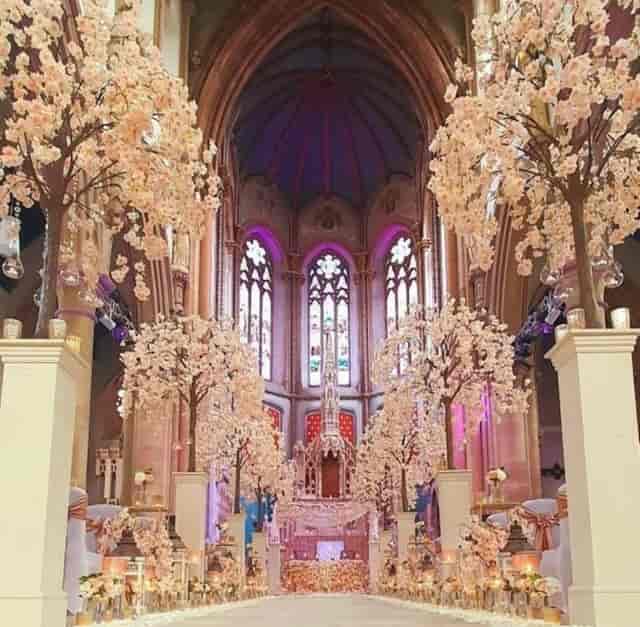 Elegant Manchester Monastery nave with cherry blossom decor for weddings and events.