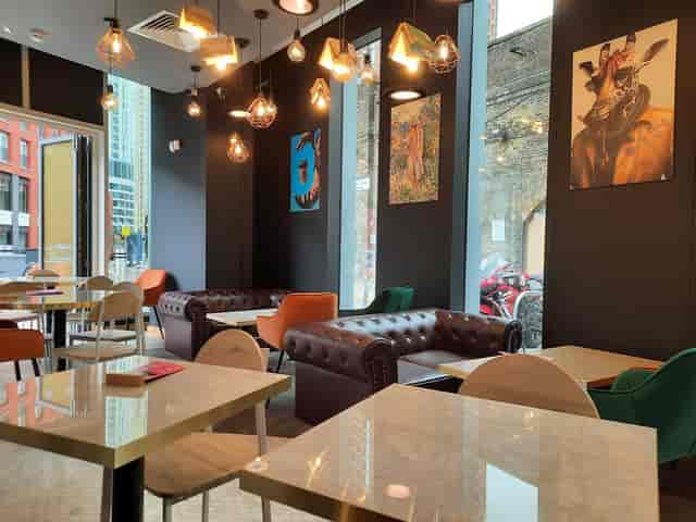 Stylish Bru Coffee event space with modern decor, ideal for networking and gatherings.