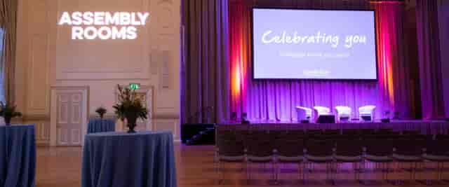Breakout room with elegant lighting for corporate events and presentations.