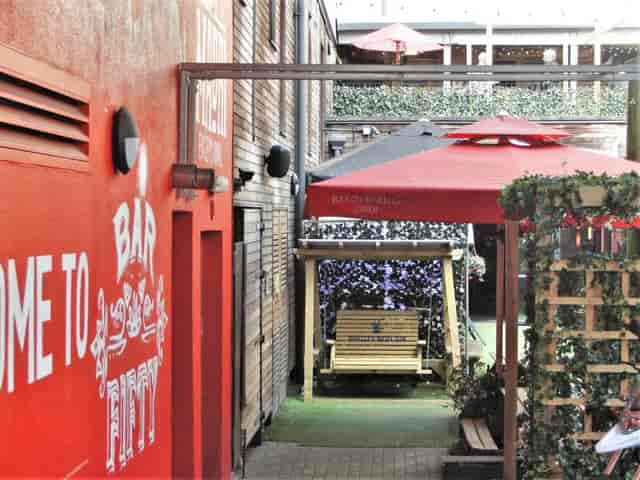 Rustic Bar 50 beer garden courtyard for networking events and corporate happy hours.