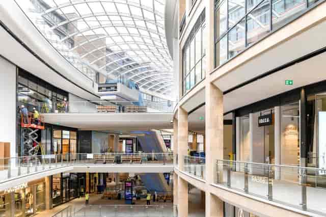 Modern serviced offices in a spacious atrium, ideal for events and exhibitions.