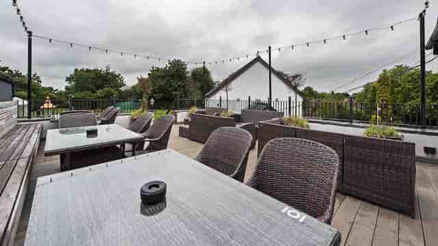 Beer Garden in Bulls Head with wicker furniture, ideal for casual gatherings and events.