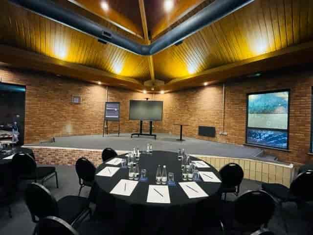 McCallum Suite at Copthorne Hotel: modern meeting space with large screen, ideal for events.