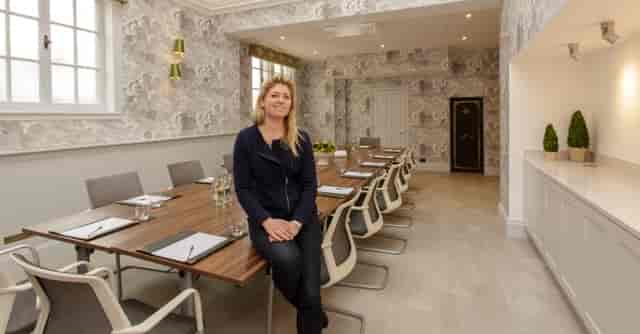 The Boardroom at The Wood Norton: modern meeting space with large wooden table for corporate events.
