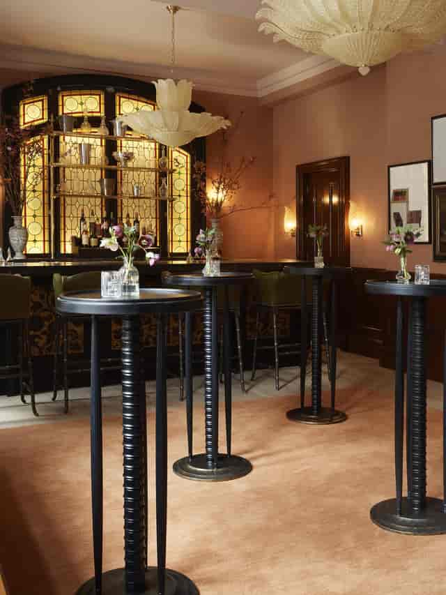 Sophisticated event space in The NoMad London with elegant floral arrangements.