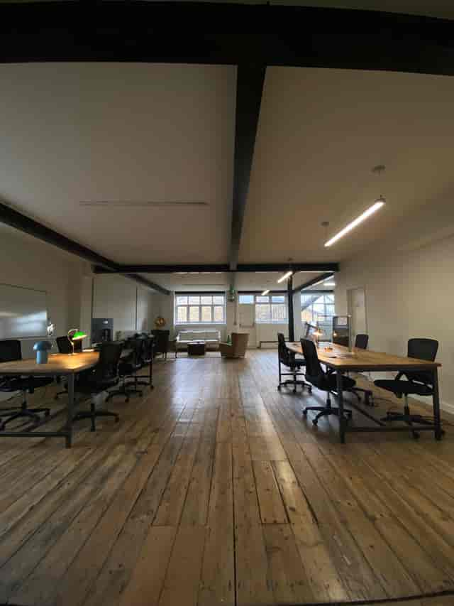 Spacious meeting room with natural light for collaborative workshops and brainstorming sessions.