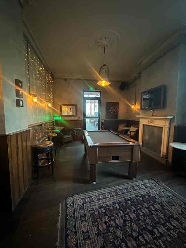 Cozy billiard room with pool table, ideal for networking and team-building events.