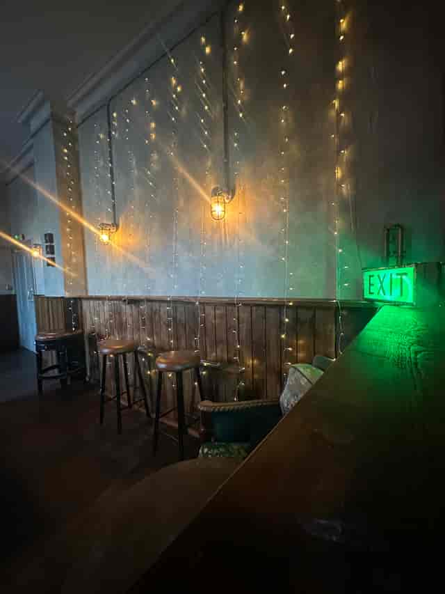 Cozy billiard room with warm lighting for intimate gatherings and networking events.