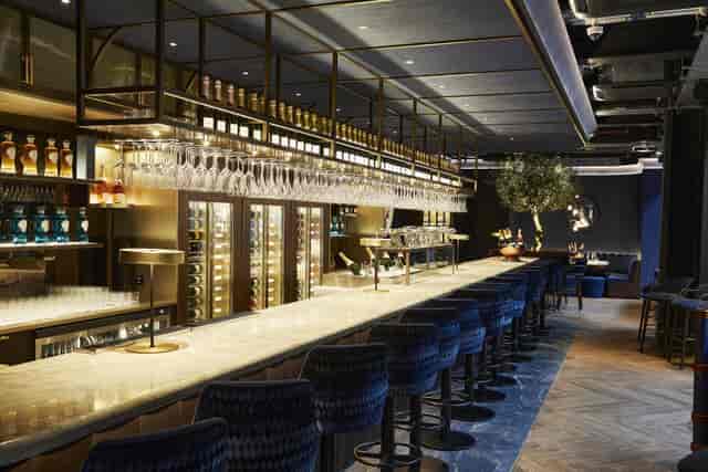 Searcys Champagne Bar at Battersea Power Station, modern marble bar for cocktail receptions.