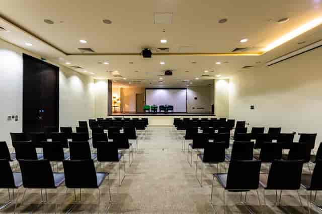 Meeting space with black chairs for conferences at Guildford Harbour Hotel.