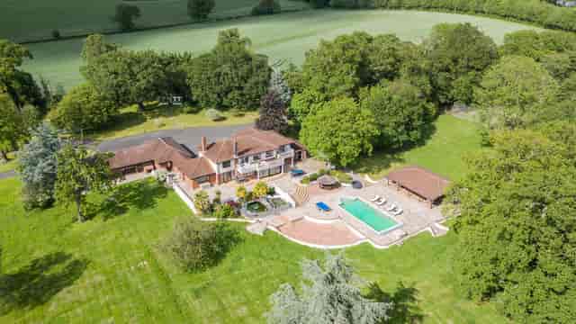 Villa Mansion venue with lush greenery, ideal for outdoor events and retreats.