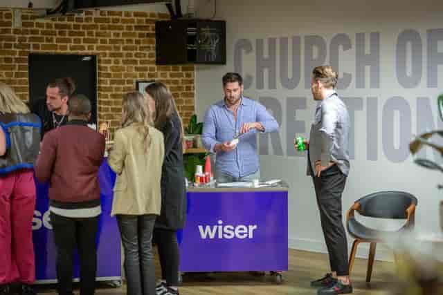 Vibrant networking event at EC1 Campus with attendees engaging over refreshments.