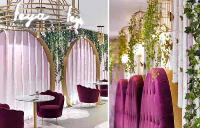 Elegant event space with lush greenery and cozy purple seating for modern gatherings.