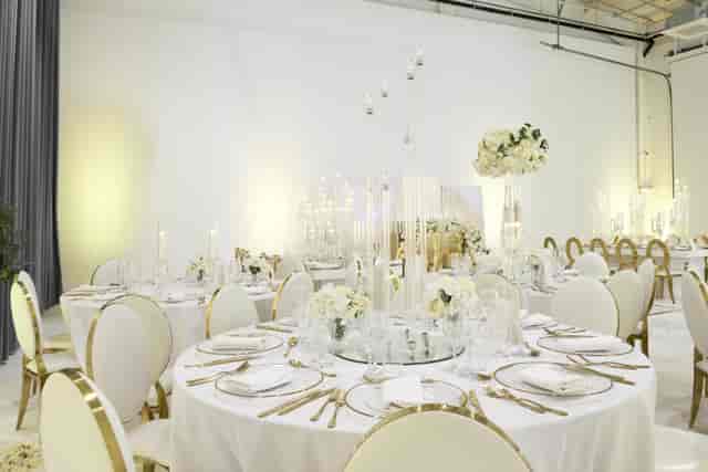 Elegant banquet table with floral centerpieces for weddings and corporate events.