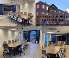 Modern boardroom at St. Peter's House, ideal for meetings and events with natural light.