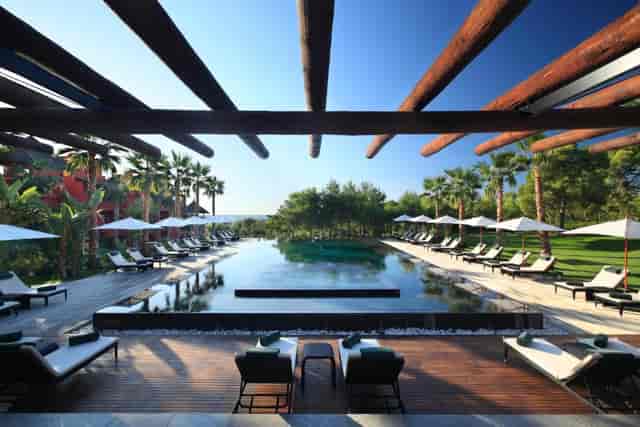 Outdoor venue at Asia Gardens Hotel with serene pool, ideal for upscale events and receptions.
