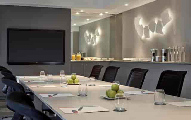Modern Mayfair Suite meeting room with sleek table, ideal for productive events.