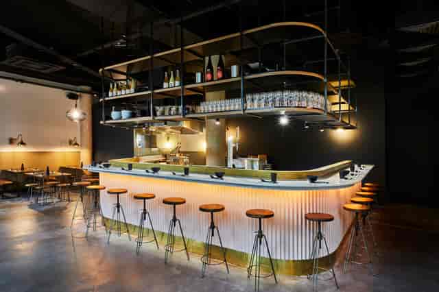 Sleek bar area in Kanada Ya Ealing, ideal for networking events and cocktail receptions.