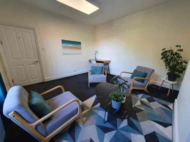 Cozy Oxford Meeting Room with plants, perfect for team meetings and brainstorming sessions.
