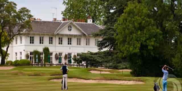 Dyrham Park Country Club golf course with elegant clubhouse, ideal for corporate retreats.