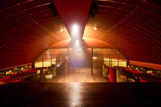Stylish Omeara event space with arched ceiling for corporate meetings and social gatherings.