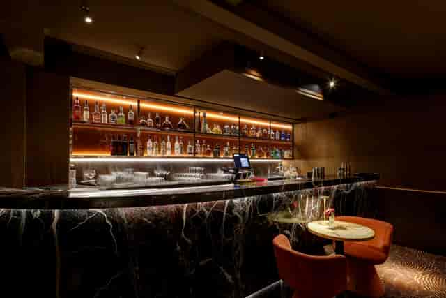 Private dining room at Bocconcino Soho with marble bar, ideal for networking events.