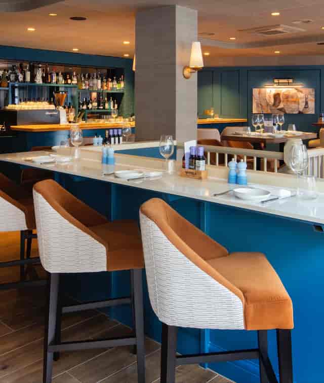 Stylish dining area at Bellazul restaurant, ideal for intimate gatherings and networking events.