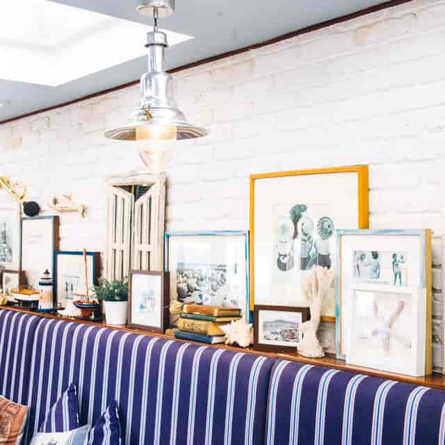Dining room at The Summerhouse with coastal decor, ideal for events and networking.