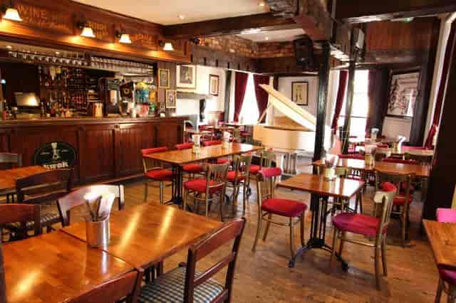 Piano Room in Toulouse Lautrec: cozy venue for intimate gatherings and live music events.