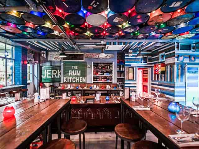 Vibrant cocktail bar with rustic decor, ideal for social events and networking.