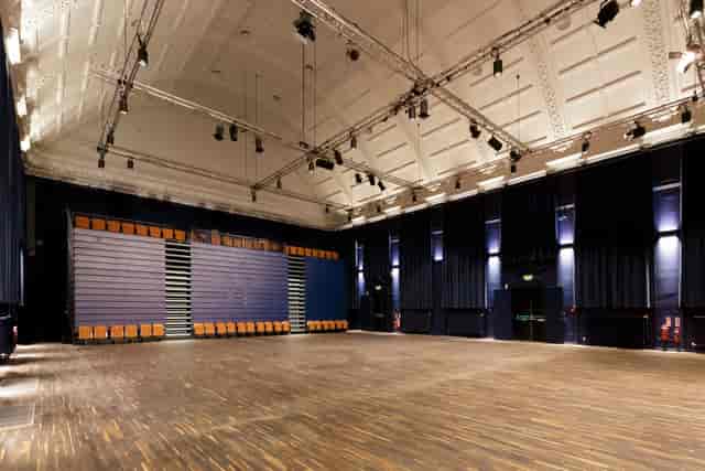 Rehearsal at Blackheath Halls, spacious venue with polished wooden floor for events.