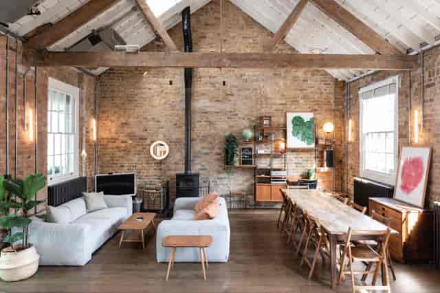 Stylish Loft Studio event space with exposed brick, perfect for workshops and gatherings.