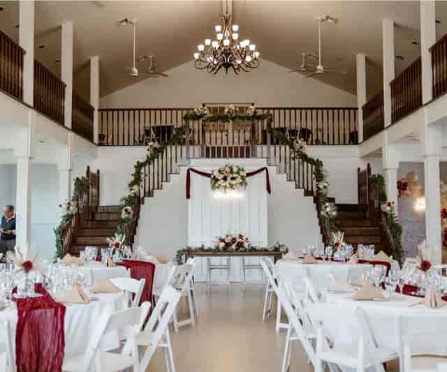 Elegant Hofmann Ranch event space with floral staircase, ideal for weddings and gatherings.