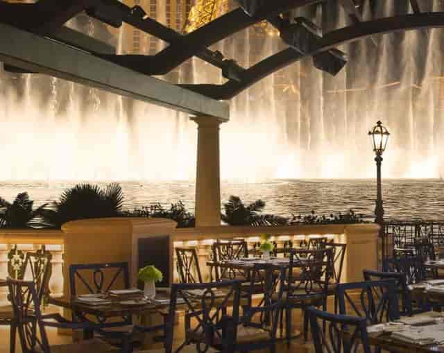 Elegant outdoor patio venue with fountain, perfect for upscale receptions and gala dinners.