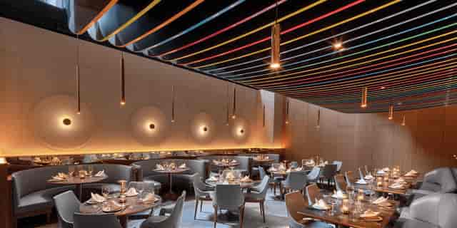 Modern dining room with elegant table settings for upscale events at 53 Restaurant.