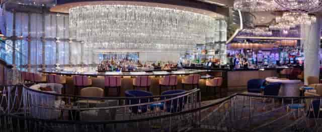 Chandelier Lounge bar at Cosmopolitan, elegant decor for networking events and gatherings.