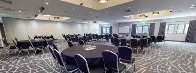 Inspiration 2 meeting space in Cardiff, featuring round tables for networking events.