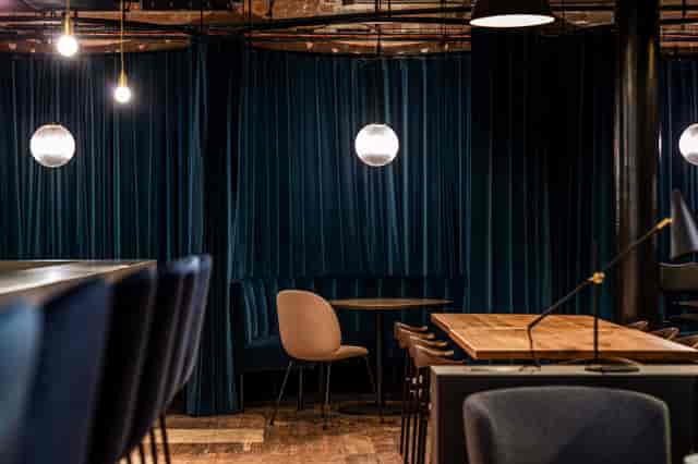 Plush velvet booths in The Ministry lounge for corporate networking and high-end social events.