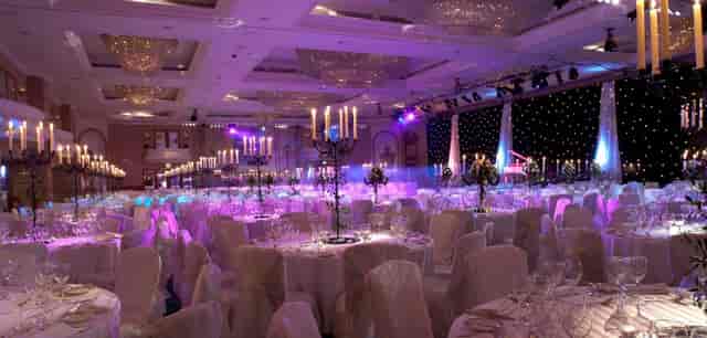 Elegant ballroom with soft lighting, ideal for weddings and galas.