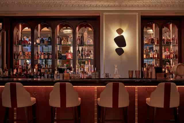 Atrium bar at 100 Queen's Gate Hotel, elegant setup for networking events and cocktail receptions.