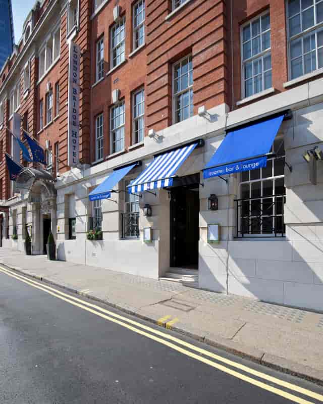 Stylish Quarter Bar & Lounge entrance with blue awnings, ideal for events and meetings.