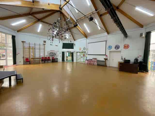 Upper Hall at Alpha Grove: Versatile venue with vaulted ceilings, ideal for workshops and events.