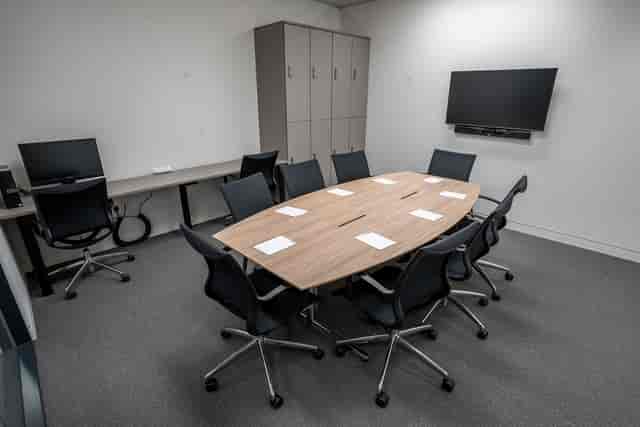 Study room in London Conference Centre with oval table for collaborative meetings.