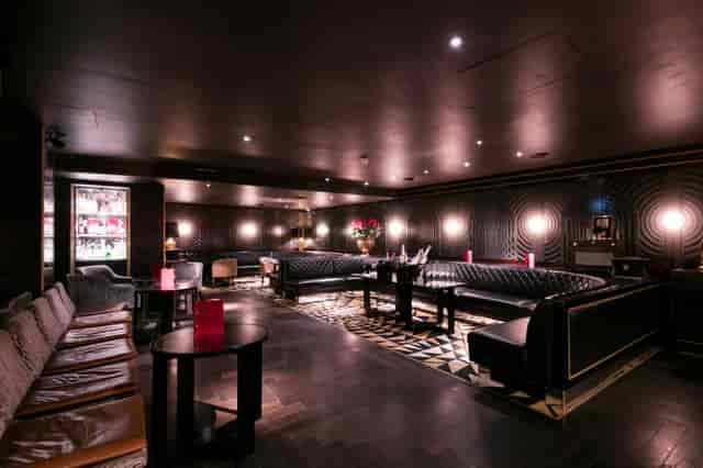 Sophisticated lounge with plush seating at Capeesh Cucina for networking events.