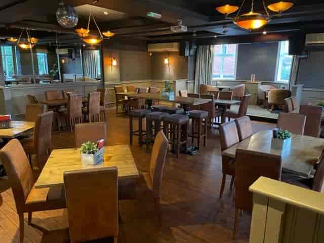Beer Garden at Winning Post: warm event space with wooden tables, perfect for networking events.