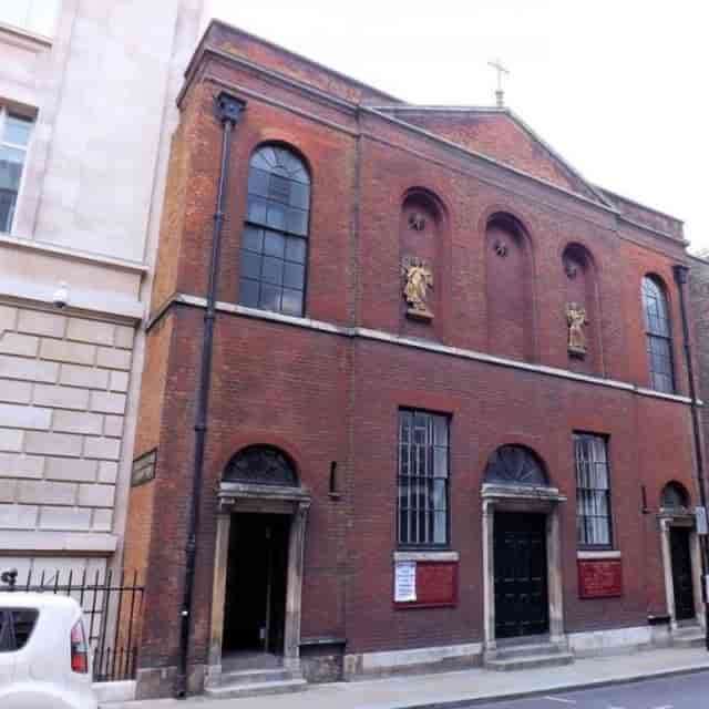 Historic Our Lady of the Assumption Church Hall with brick facade for unique events.