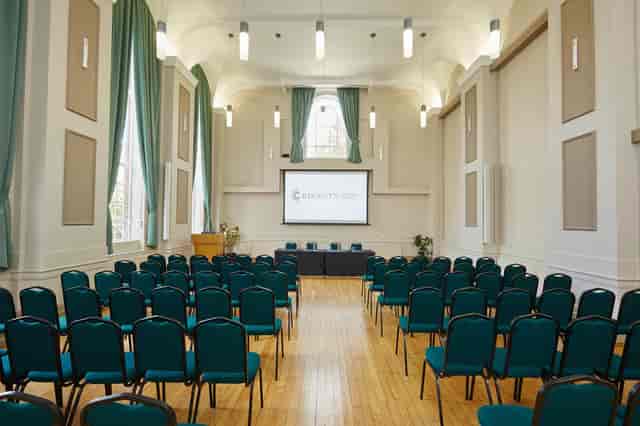 Classroom Hire in Knapp Gallery with teal chairs, ideal for conferences and seminars.