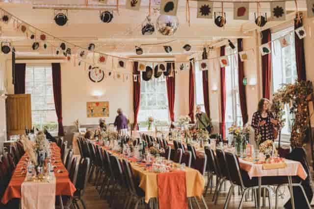 Café Bar in Mycenae House: vibrant event space with floral centerpieces for celebrations.